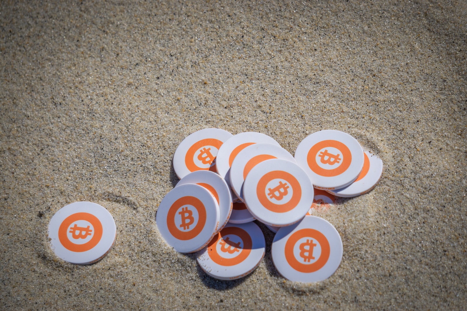 white orange and blue round buttons on brown sand